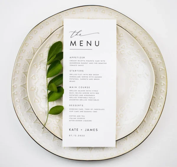 Elegant wedding menu card with floral accents and cursive lettering